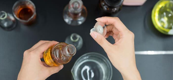 AmorePacific AmorePacific hands mixing chemicals in lab