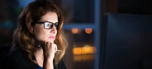 woman-lit-up-by-computer-screen-205-300x136